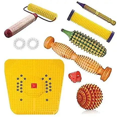 Massage tools combo kit with yellow power mat, textured rollers, and spiky massage ball