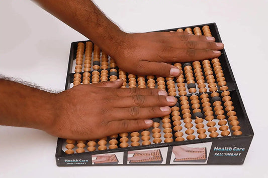 Acupressure foot massager roll with wooden bead pins on black base