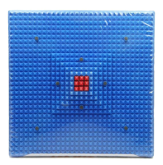 Blue acupressure foot mat with raised studs and red magnetic center