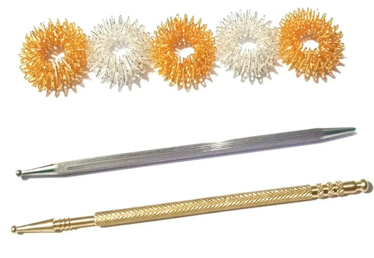 Acupressure ring set with five spiked rings and two gold-tone applicator sticks