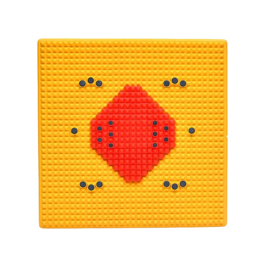 Acupressure mat with red diamond insert and blue nodules on yellow surface