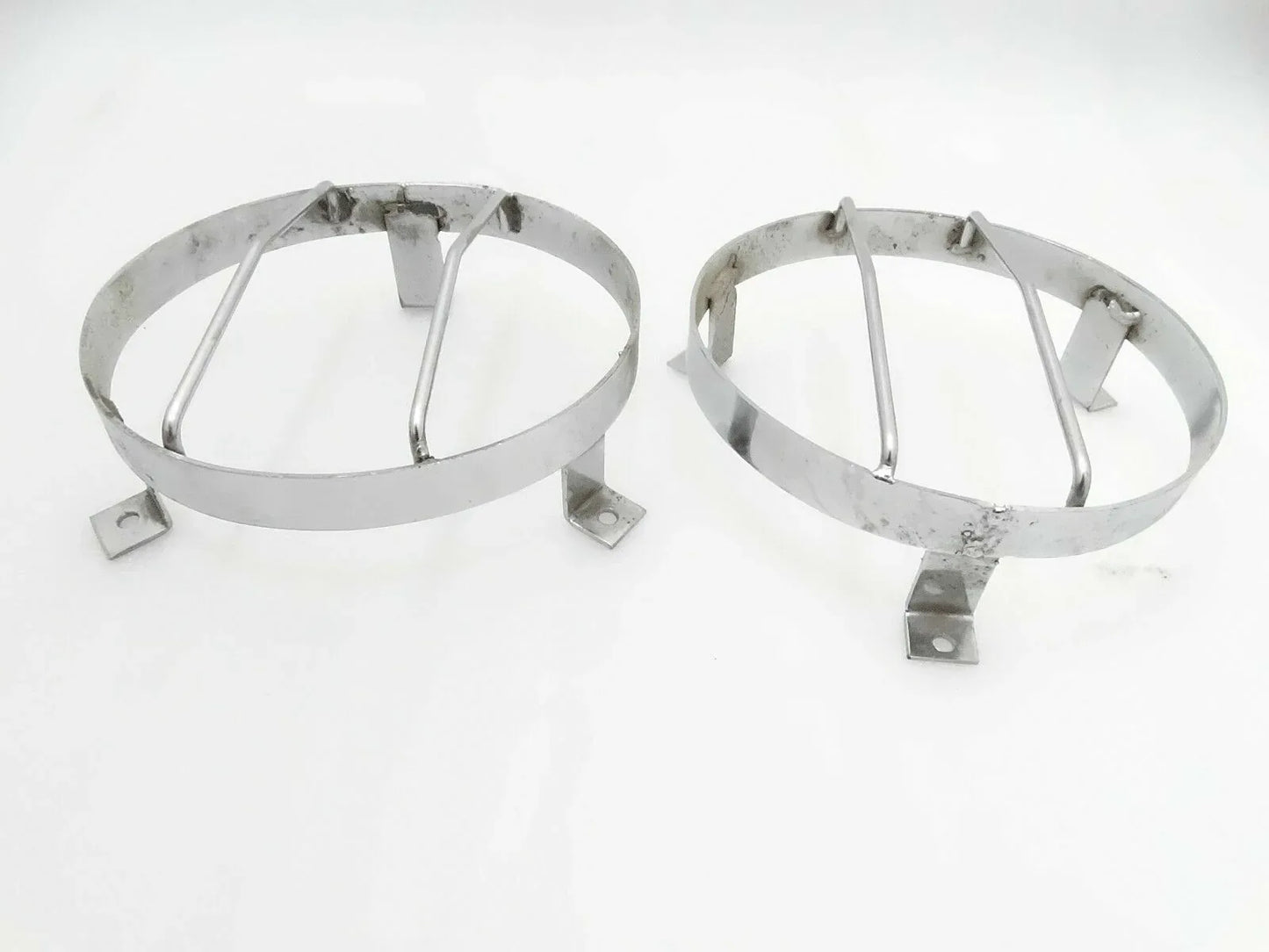 Chrome plated external headlight grill guard pair, two round metal rings with brackets