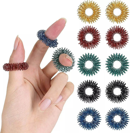 Assorted acupressure finger massager rings in vibrant colors for finger relaxation and stress relief