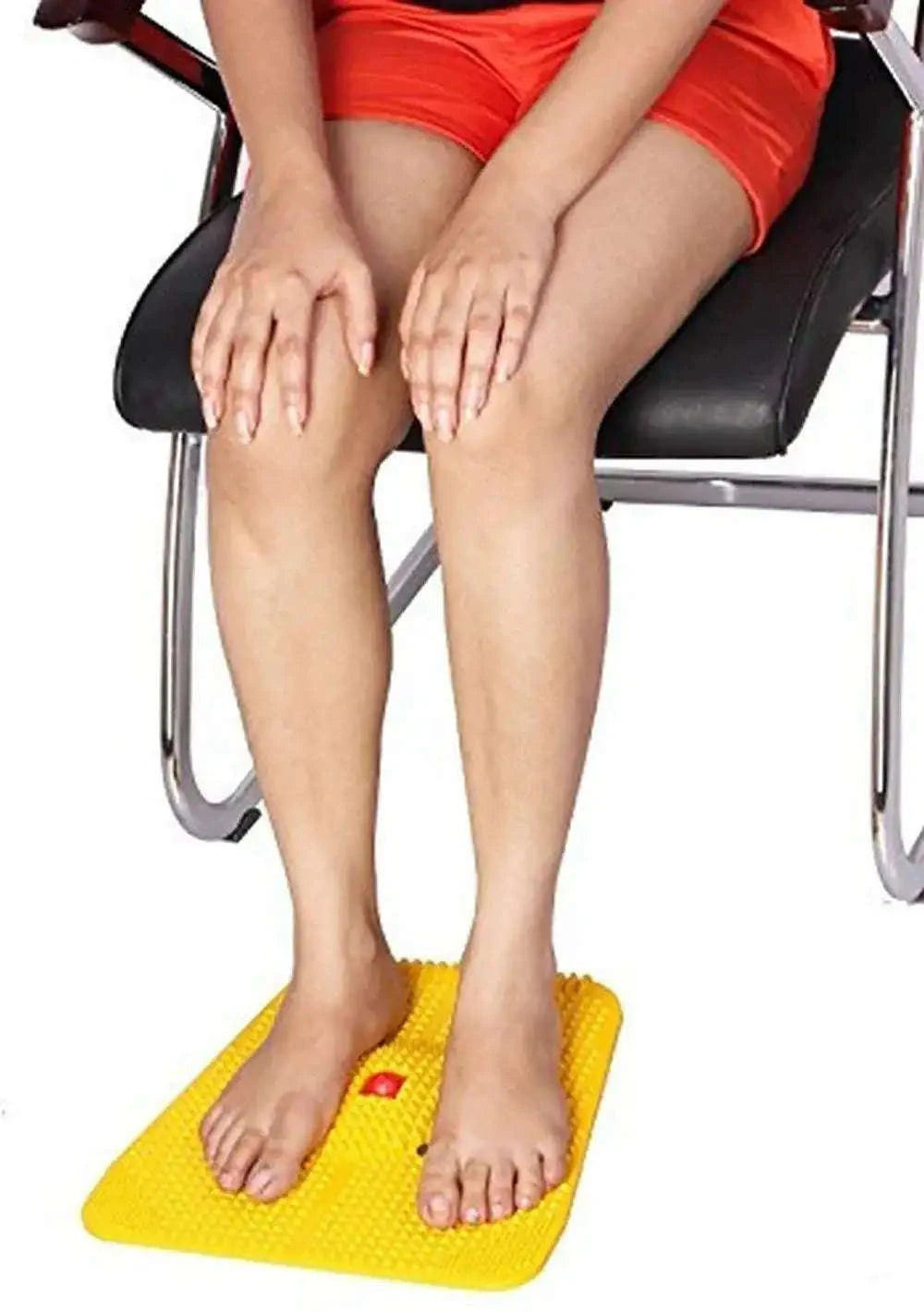 Yellow acupressure massage mat for relaxation and tension relief.
