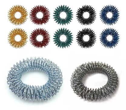Acupressure massage bracelets set featuring colorful Sujok rings in various metal finishes for therapeutic relief