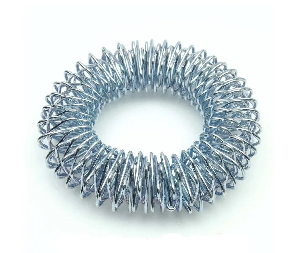 Metal acupressure wrist massage bracelet with spring coil studs