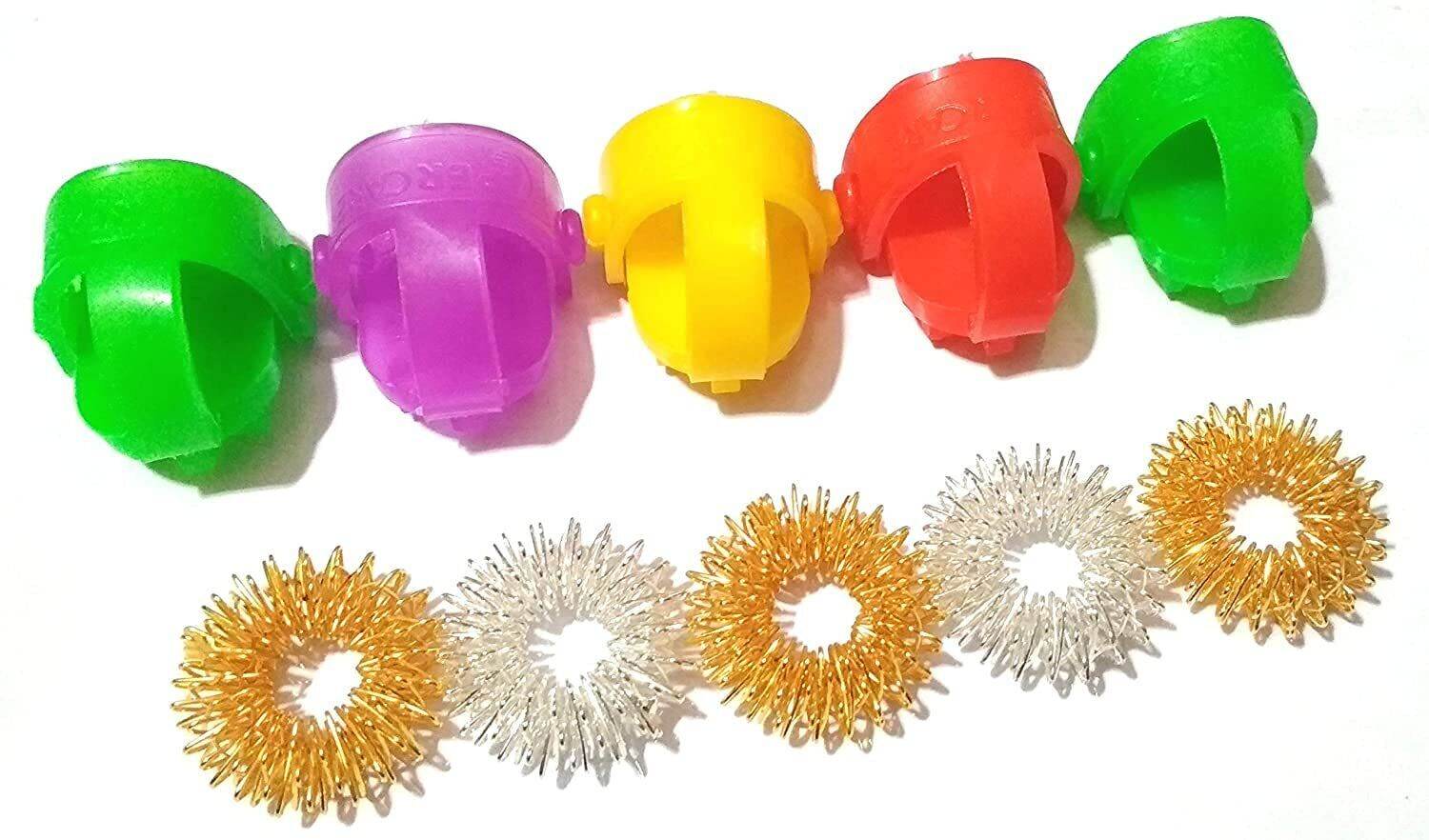 Colorful acupressure sujok ring set featuring rings in purple, yellow, red, and green