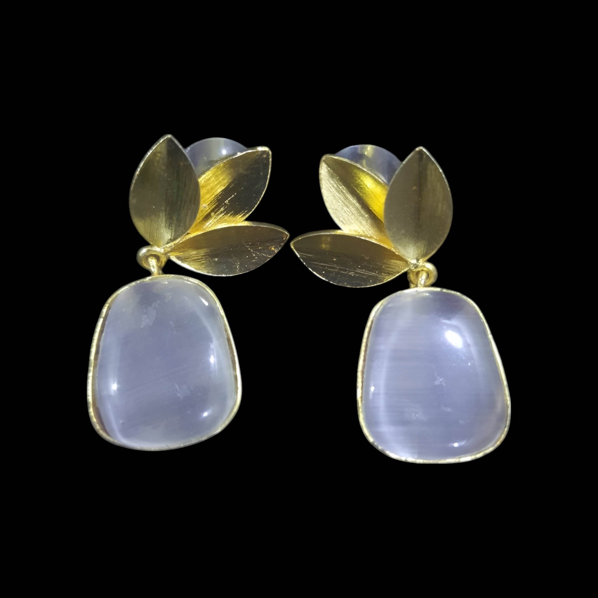 Elegant amber stone leaf design earrings with gold accents and a modern aesthetic