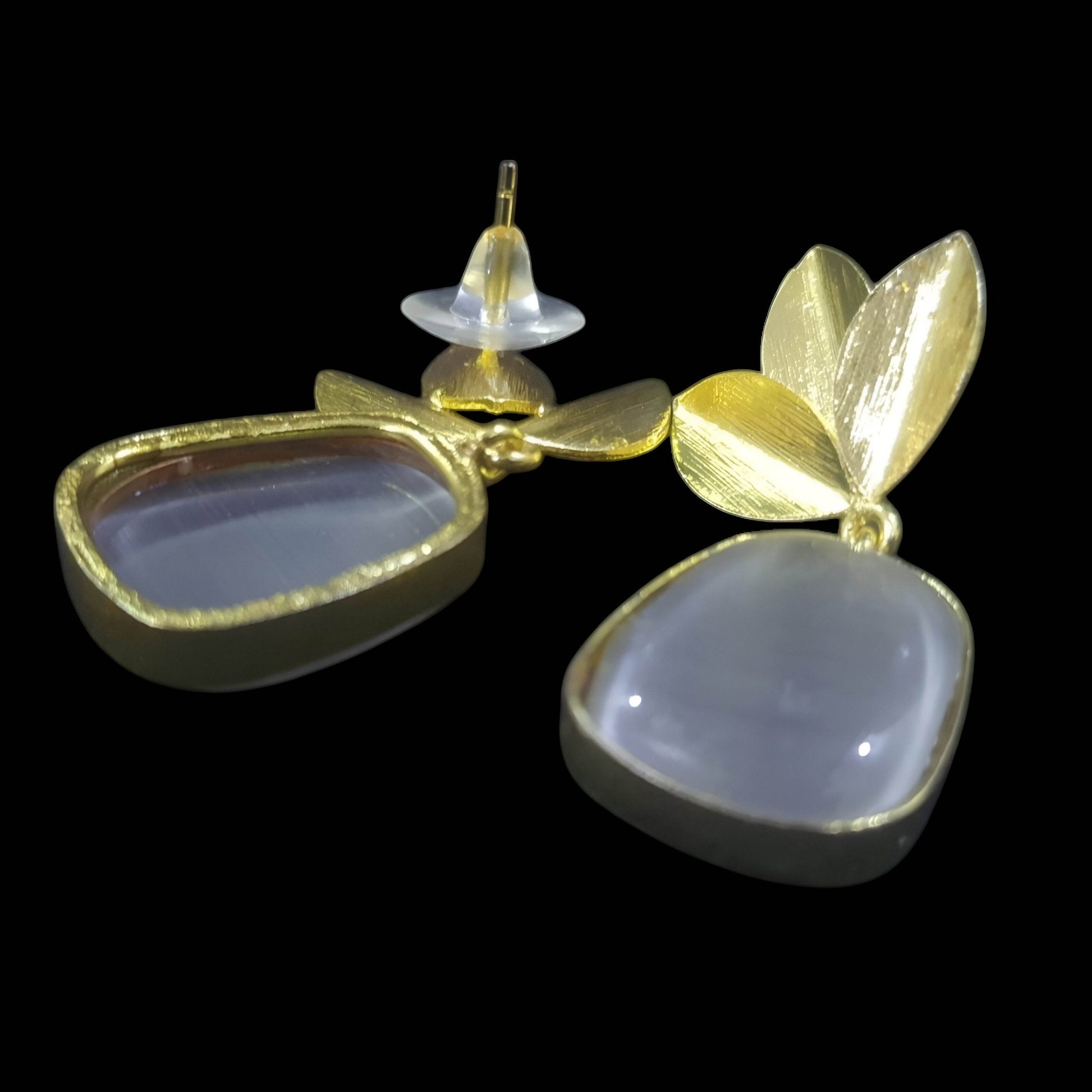 Amber stone leaf design earrings with gold accents and unique natural shapes
