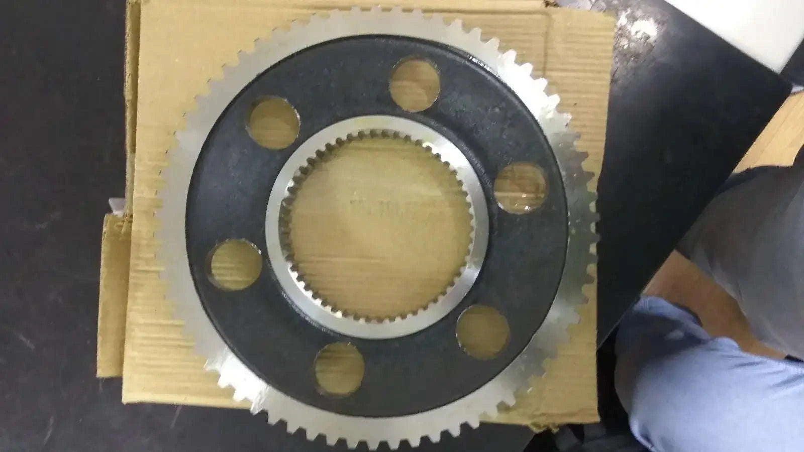 Steel gear sprocket with central ring and bolt holes