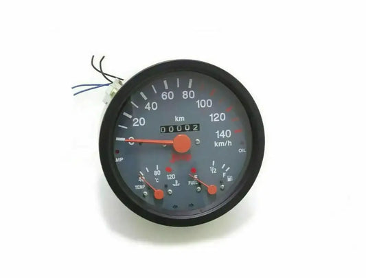 Round analog vehicle gauge cluster with black bezel, multiple needles and metric scale
