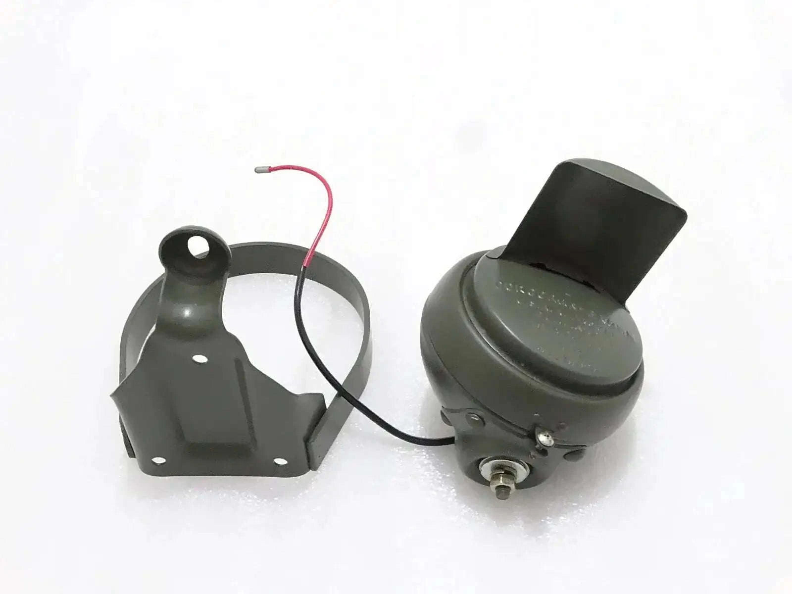 Black blackout headlight housing with mounting bracket and wiring harness