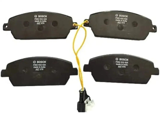 Bosch front brake pads set of four, black friction pads with wear markings