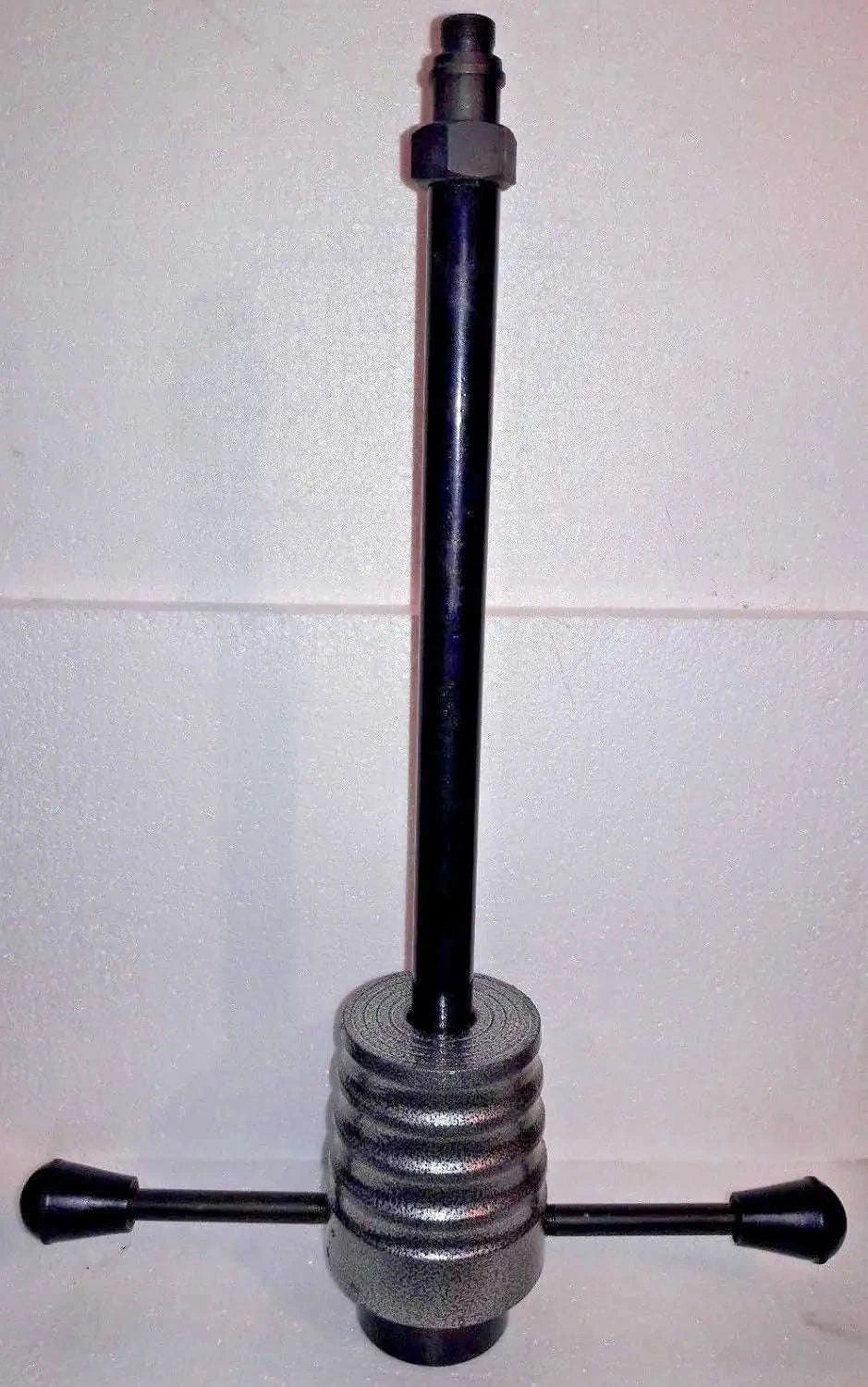 Injector puller tool with long threaded rod and spring-loaded base