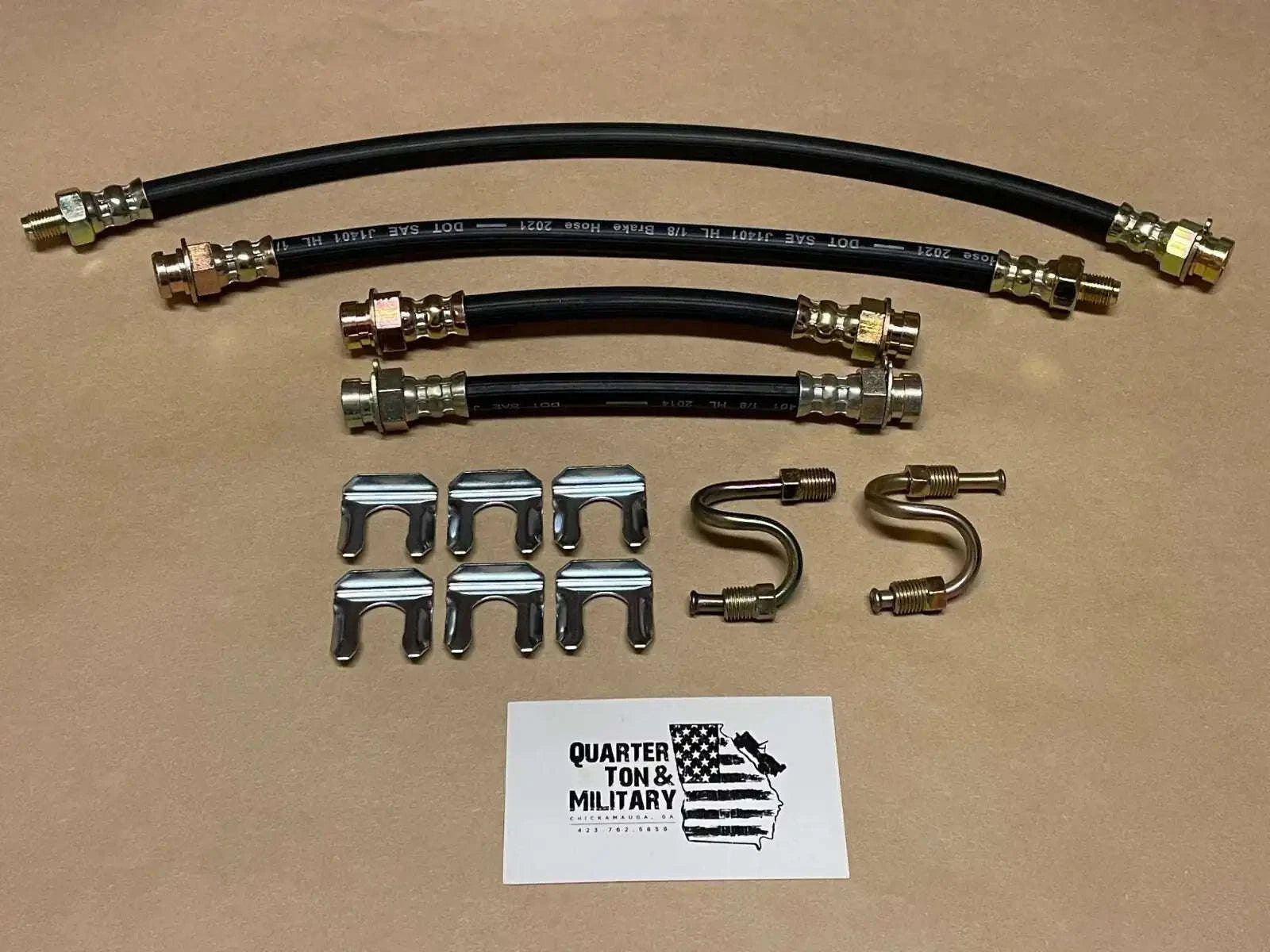Brake hose kit with black rubber hoses and metal fittings, plus clips and brackets