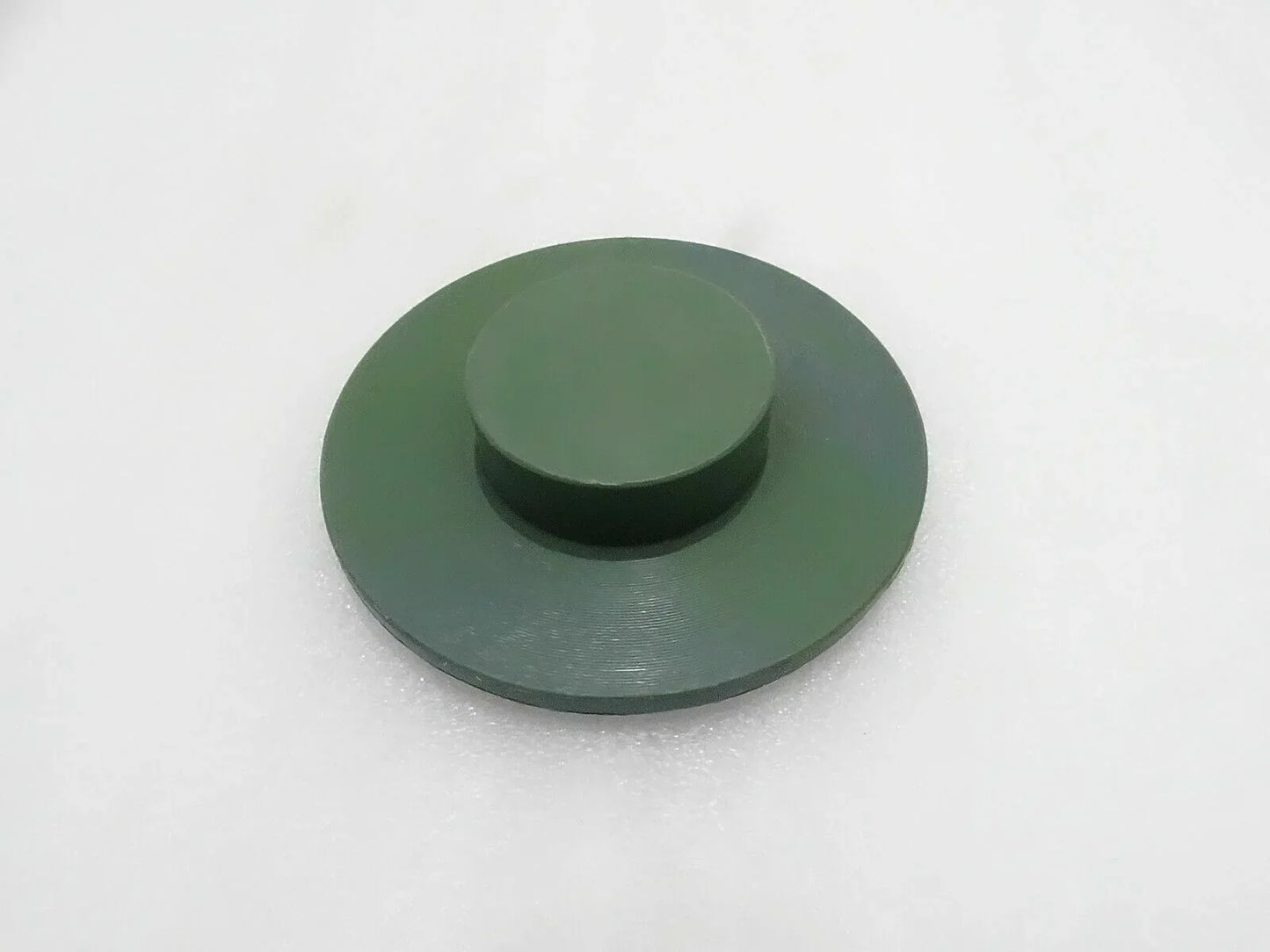 Round green stabilizer pad with raised center