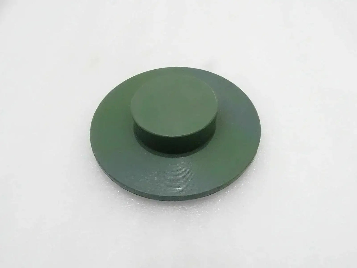 Round green stabilizer pad with raised center