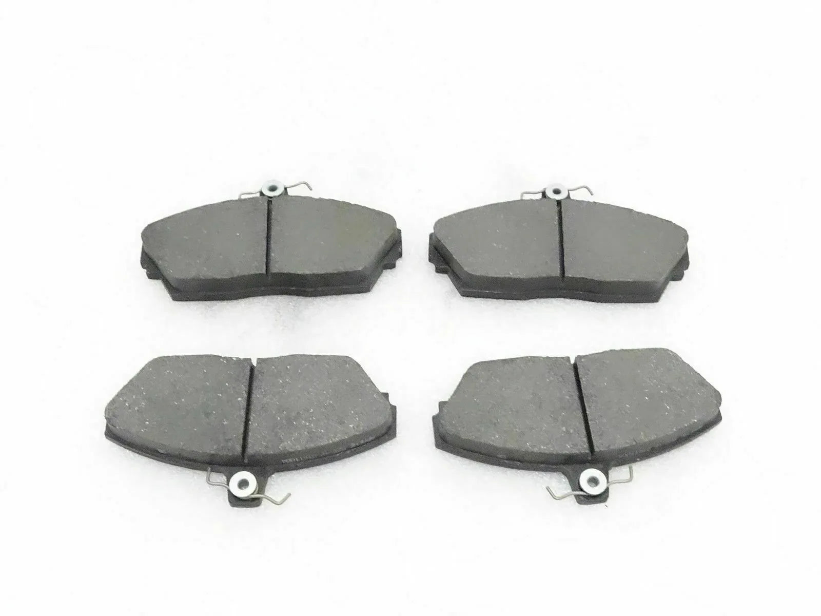 Disc brake pad set with four grey pads