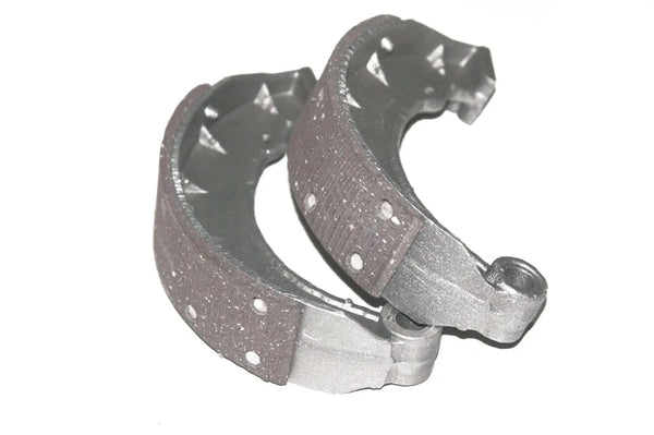 Front motorcycle brake shoe pad set, curved dark pads with rivets