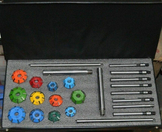 Carbide tipped valve seat cutter set including multiple cutting tools and extensions in a sturdy case