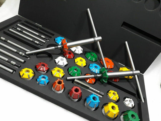 Carbide valve seat cutter kit featuring various color-coded cutters and accessories in a sturdy storage case