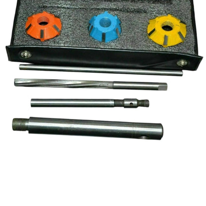 Valve seat cutter set with three colored cutter heads, two bars, and main cutter tool