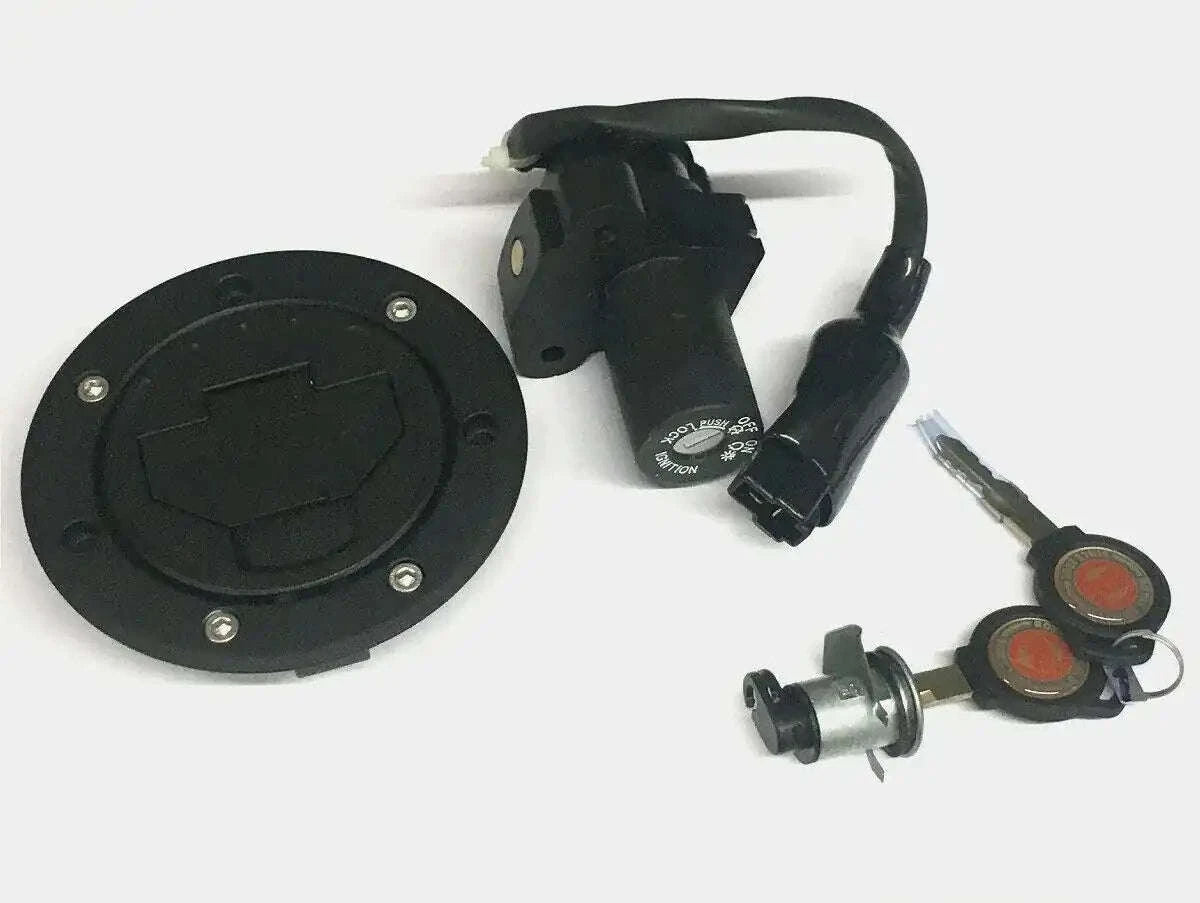 Motorcycle key set with black fuel cap, ignition switch, and two keys with red rings