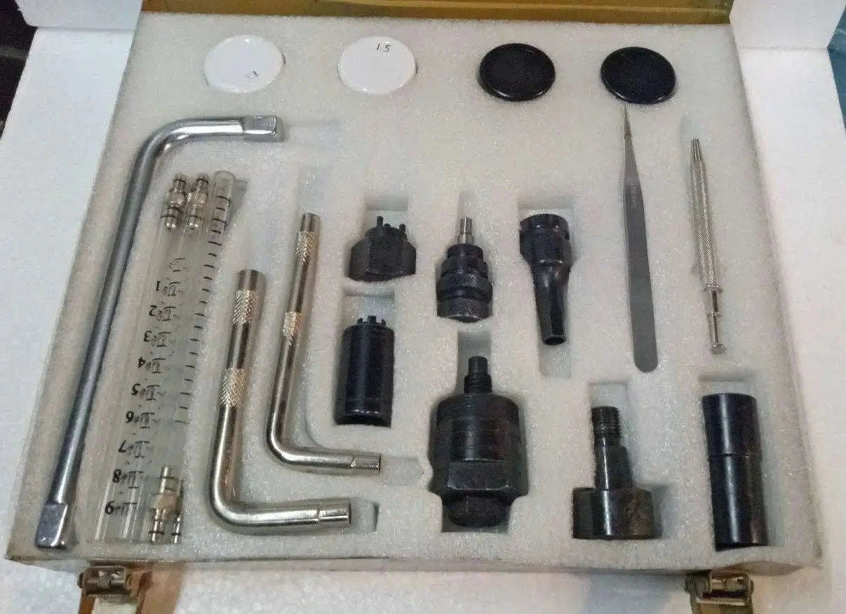 Common rail injector tools kit with metal wrenches, gauges, and injector adapter tips in case