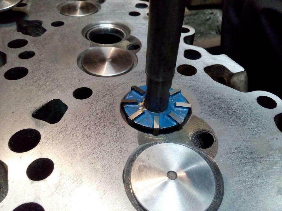 Continental TSIO 520 valve seat kit in use on an engine cylinder head for restoration