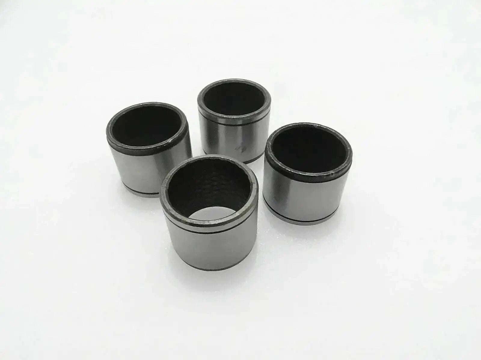Set of 4 metal link bushings, cylindrical sleeves with open ends