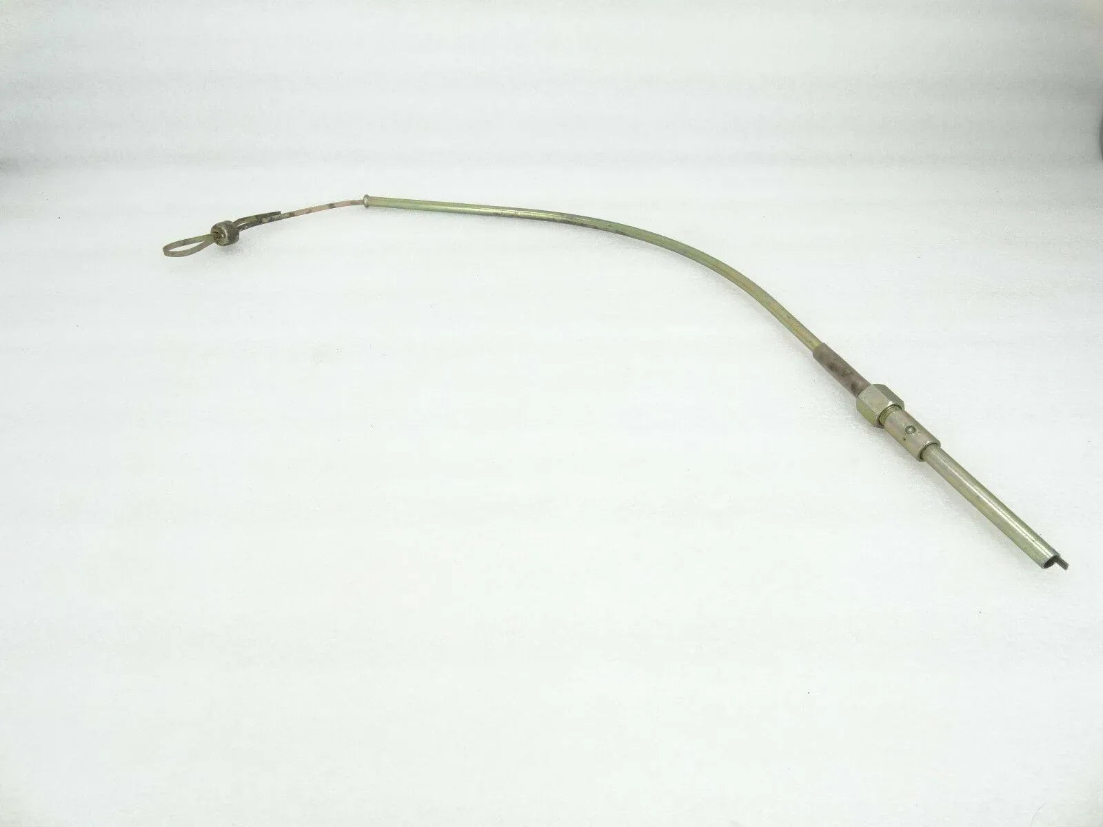 Engine oil dipstick gauge tube with loop handle and connector