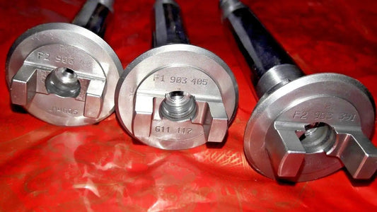 Three-piece metal drive shaft coupler set with machined ends and stamped part numbers