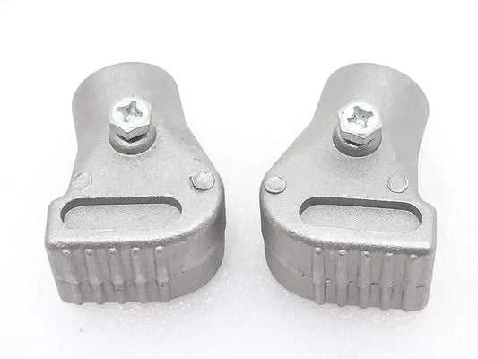 Pair of grey alloy stand feet with mounting bolt tabs