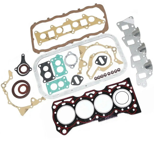 Engine gasket set with multiple gaskets, seals, and metal plates in various shapes