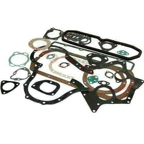 Engine overhauling gasket kit with multiple black and green seals, various shapes