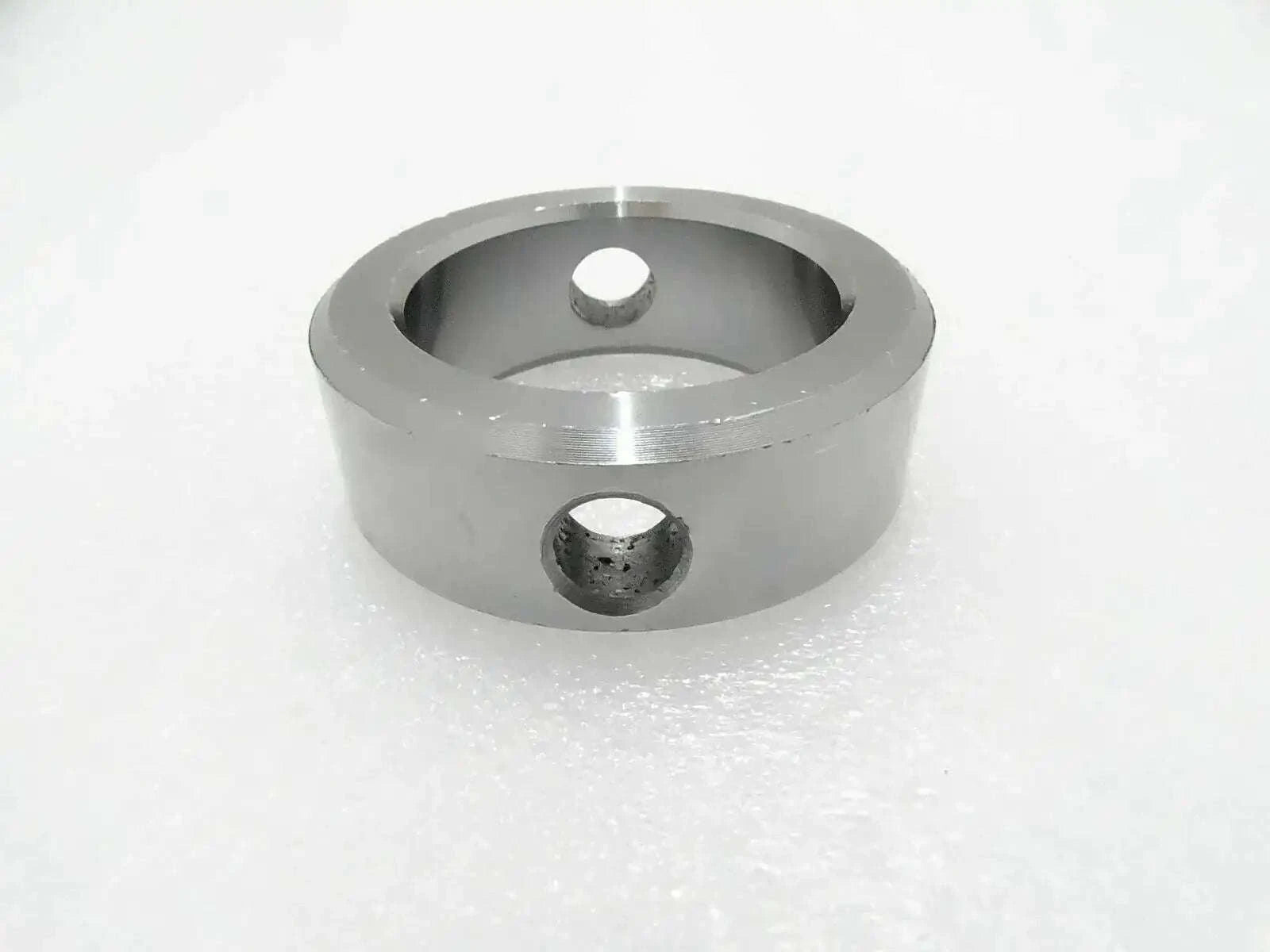 Metal pivot pin boss with two mounting holes, circular housing