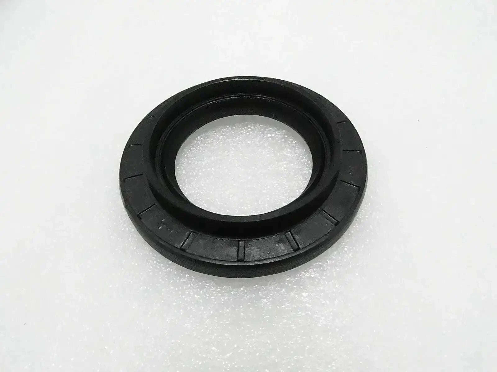 Black circular oil seal with inner sealing lip and outer housing