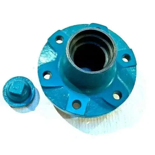 Front wheel hub with cap, teal metal, with bolt holes and central bearing opening