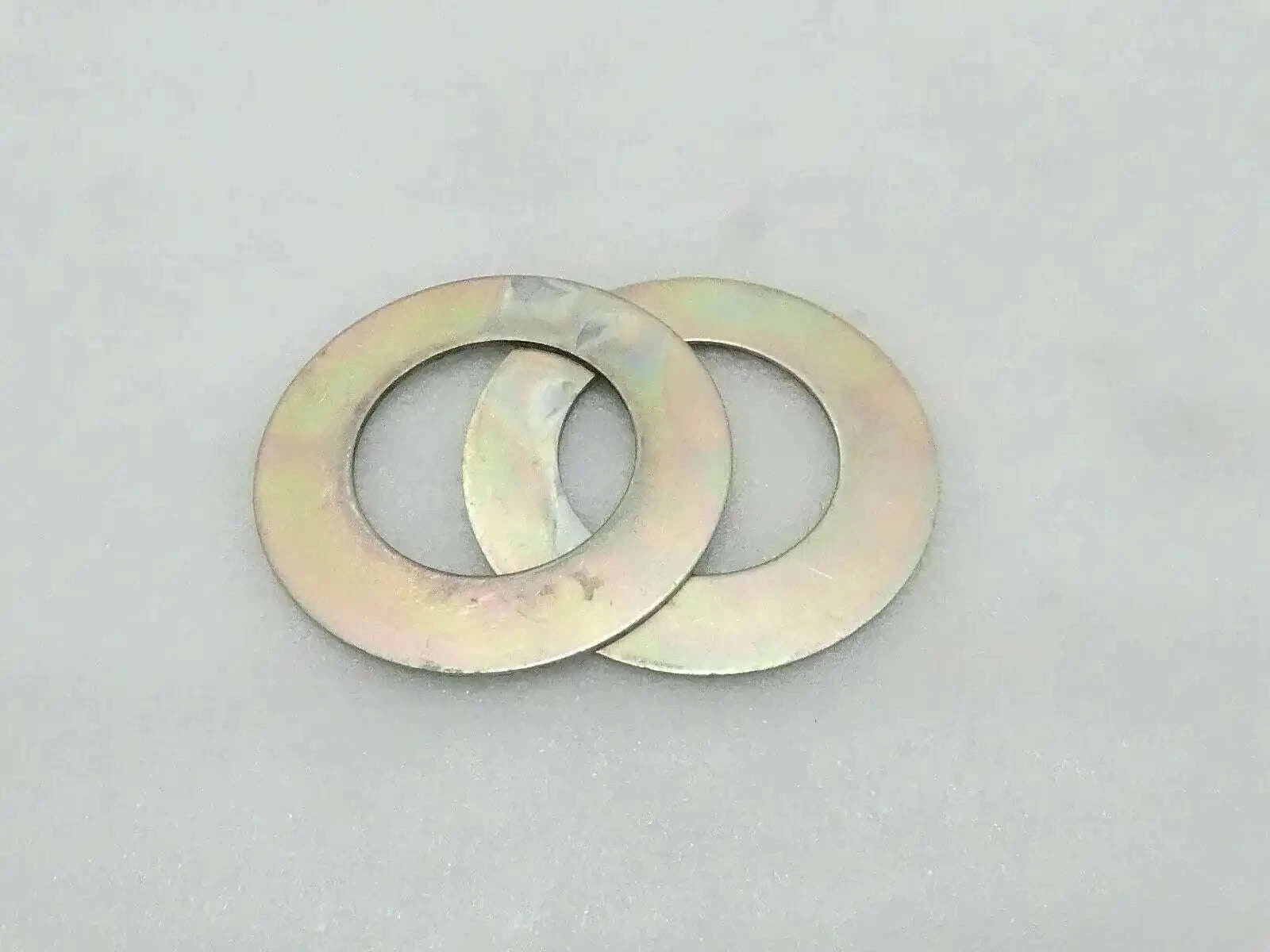 Metal shim washer pair with central holes
