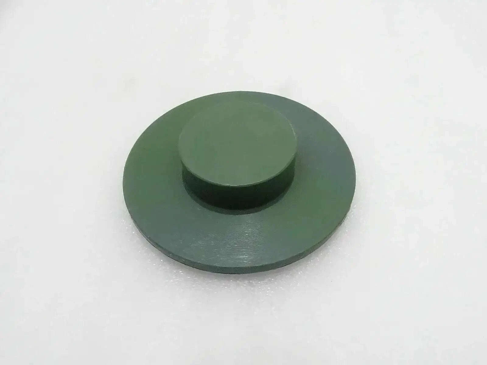Round green stabilizer pad with raised center