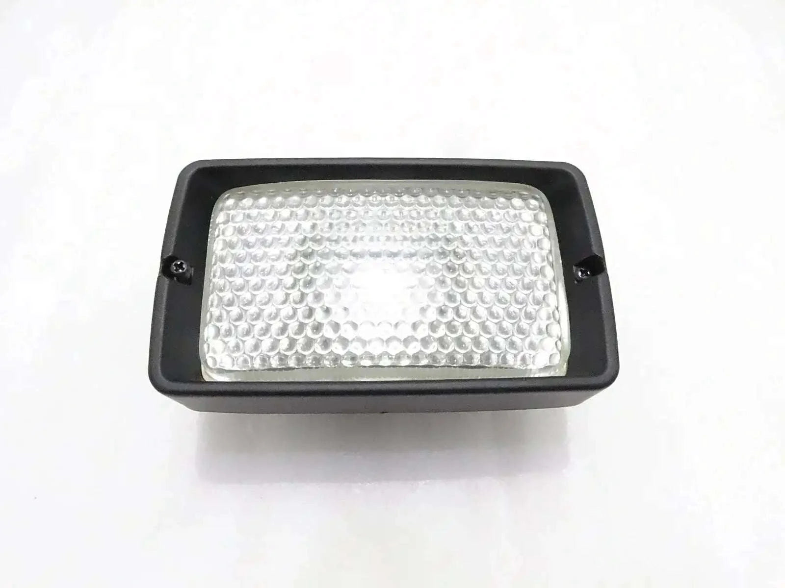 Front working light, rectangular black housing with clear textured lens
