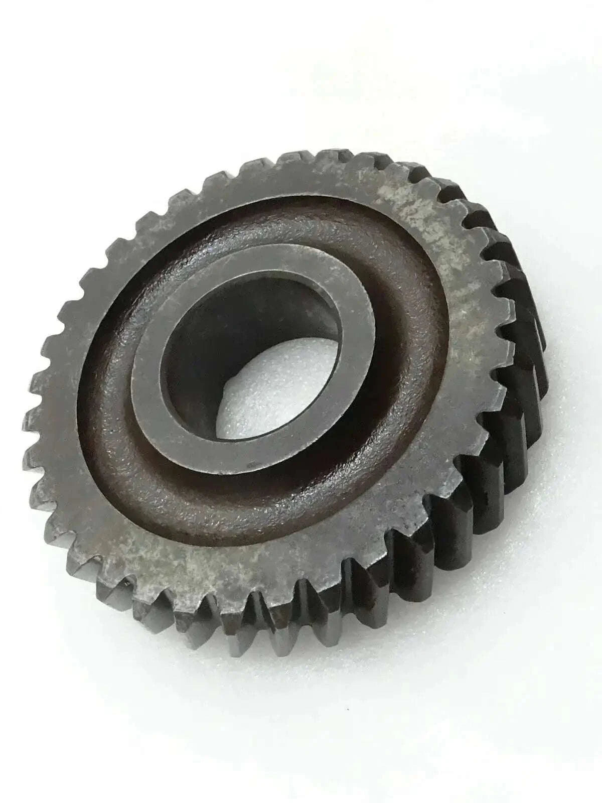 Dark steel gear idler sprocket with central bore