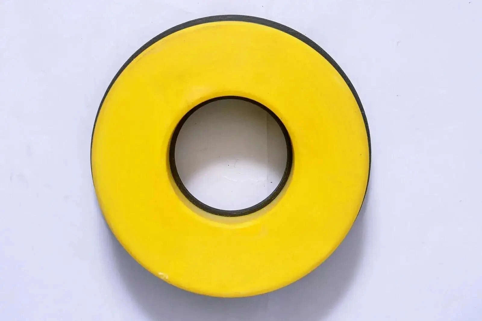 Yellow circular hydraulic clamp seal with center hole