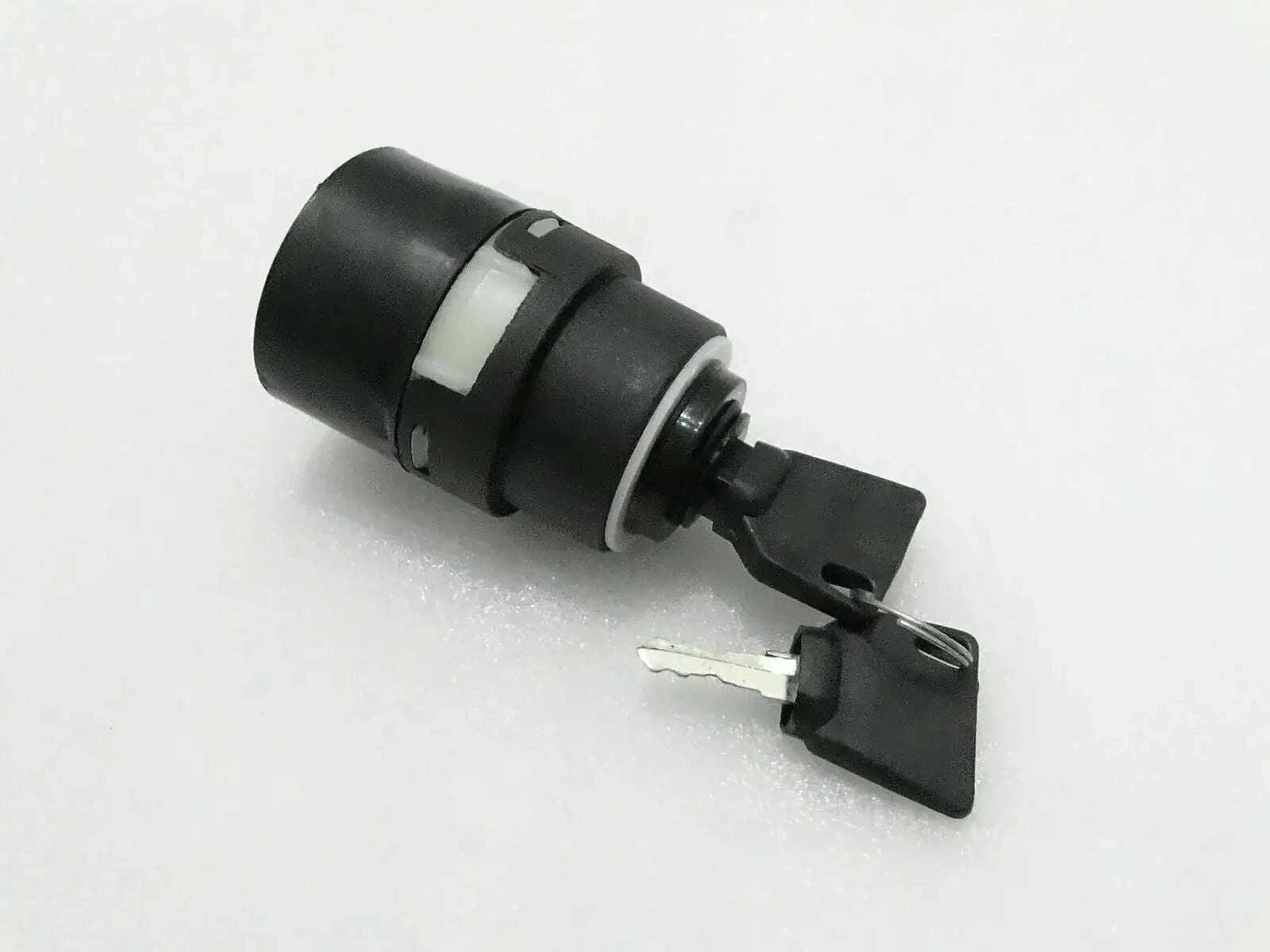 Ignition switch with two keys, black cylindrical housing with metal key blade