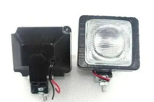 Pair of black work lights with clear square lens and mounting base