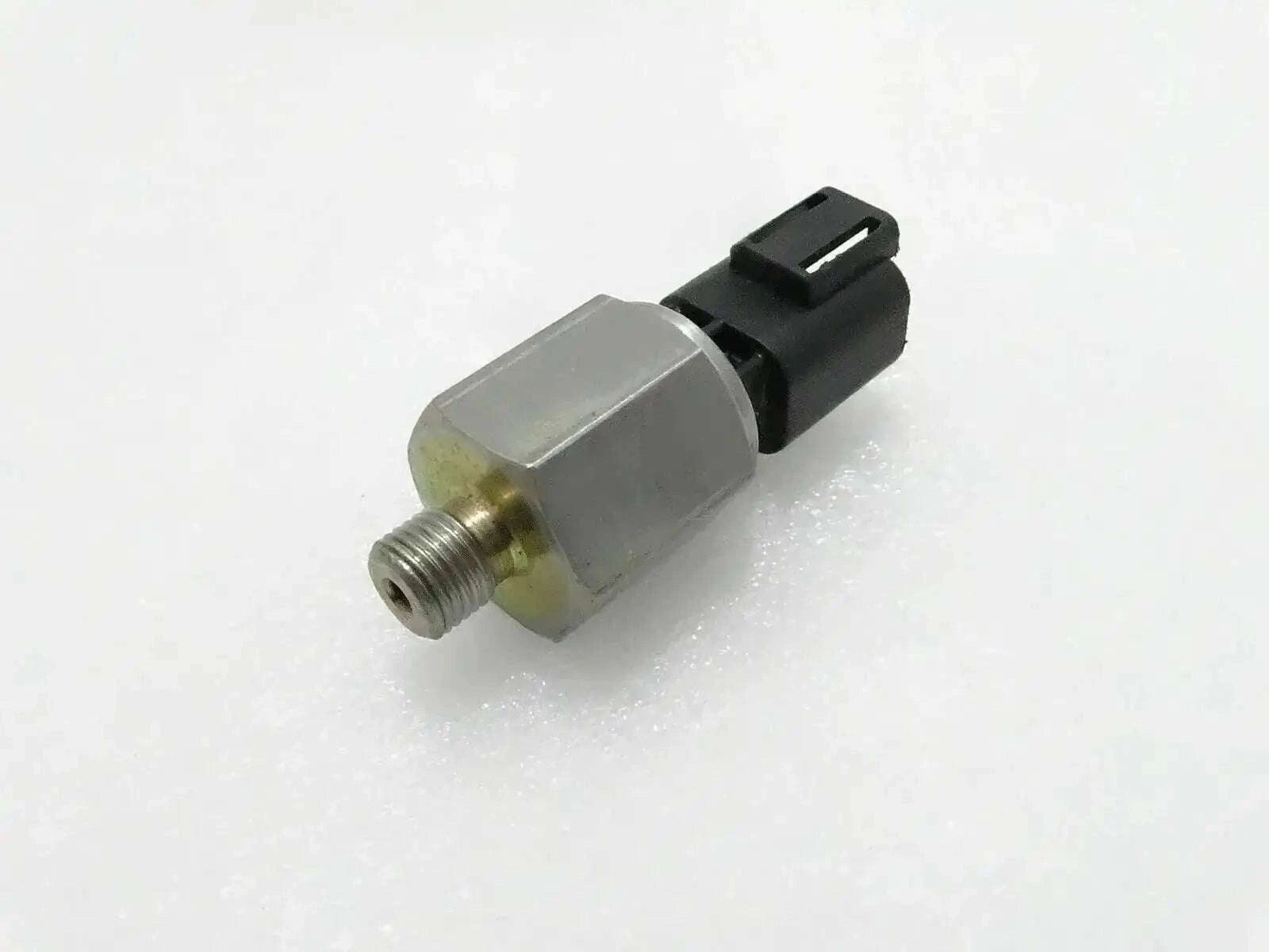 JCB 3CX oil pressure switch, stainless steel, compact size, essential for engine oil monitoring