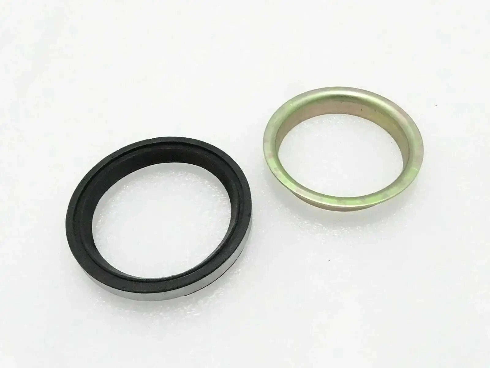Oil seal and hub sleeve set with black rubber ring and metal outer sleeve