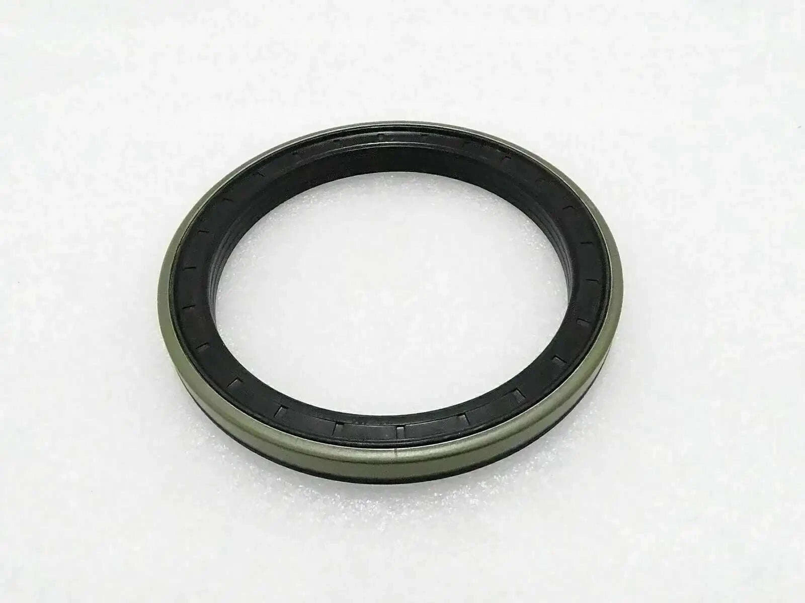 Piston seal ring with black rubber lip and green outer body