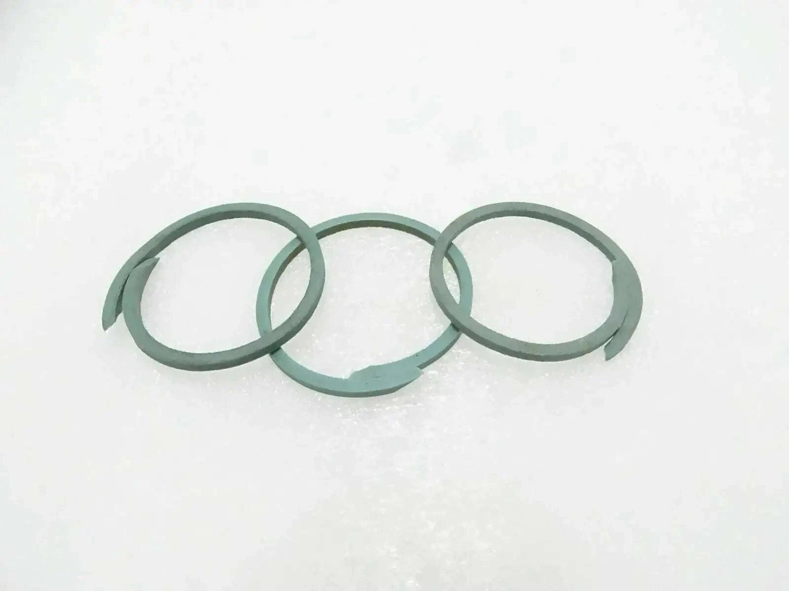 Set of three green seal rings for machinery, circular gasket rings