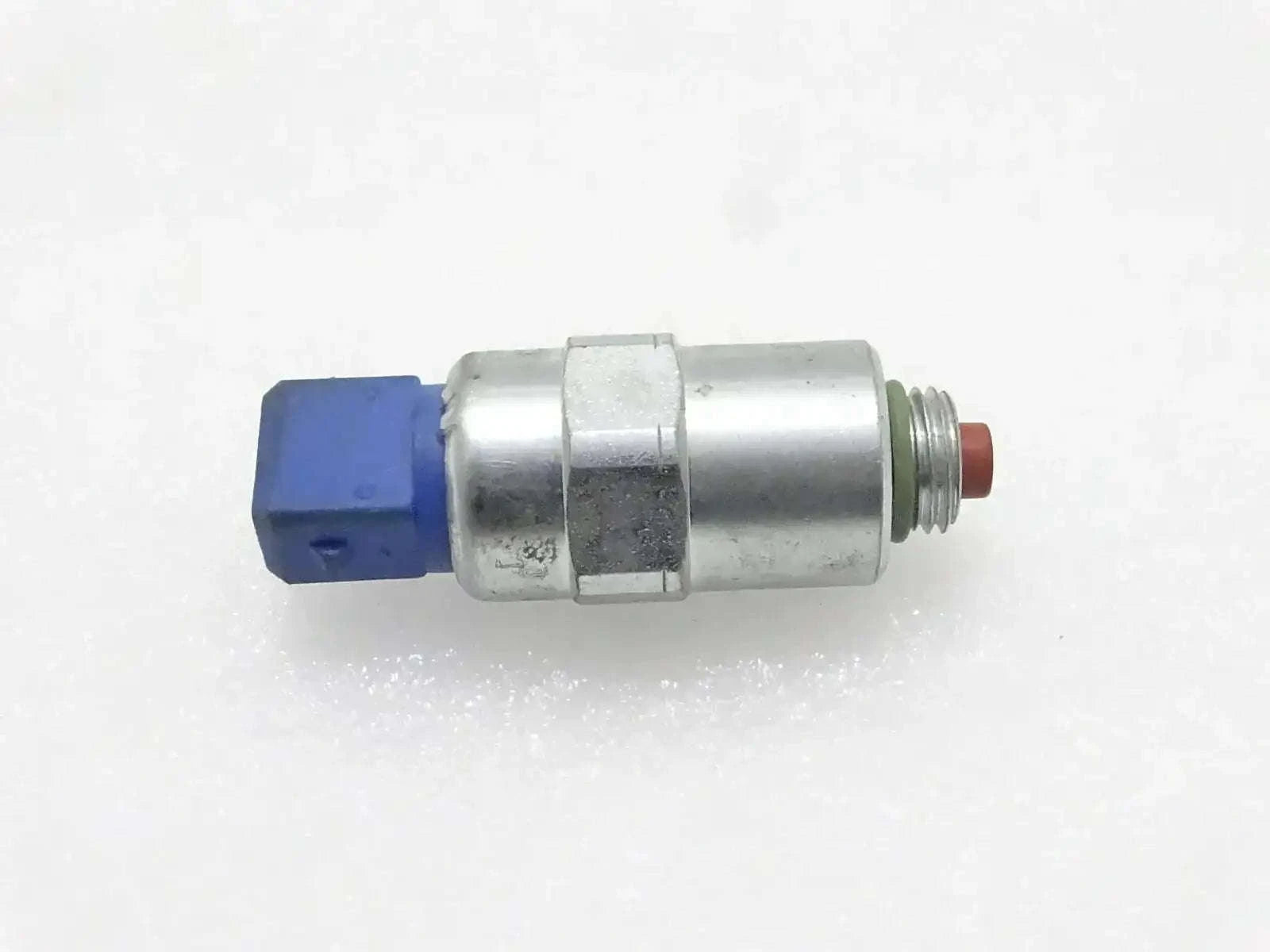 Solenoid fuel pump with metal body, blue connector, and red terminal tip